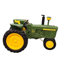 a green and yellow toy tractor on a white background