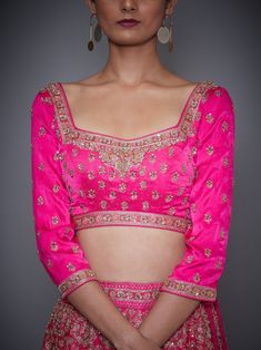 Editor's Note This set features a neon pink embroidered lehenga with blouse and dupatta. Sleeve Type: 3/4 Sleeves Neck: Square Neck Fabric: Silk Satin 80 Gms Care: Dry Clean Only About the DesignerRi Ritu Kumar is one of India’s foremost designers. She has developed a unique style of her own, reflecting the ancient traditions of Indian craftsmanship in a contemporary vocabulary. With a background in art history and museology, which has enriched her horizons, Ritu’s understanding of ancient desig Indian Choli, Lehenga With Blouse, Embroidered Bridal Lehenga, Choli Blouse, Ritu Kumar, Pink Lehenga, Embroidered Lehenga, Embroidered Neckline, Satin Color