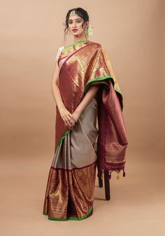 "Pride of Telangana, Gadwal Sarees are known for its splendid zari work, striking colors, and beautiful weaves. This saree comes in an elegant Gray and has floral zari motifs all over the body. The beauty of the saree is further amplified by the extravagant 16\" contrasting borders that make this saree ramp worthy and a treasured heirloom piece! SILK MARK CERTIFIED This saree is ready to wear with fall and pico done. Handmade silk tassels adorn the pallu and add more grace to it. An unstitched b Indian Clothes Women, Gadwal Sarees, Designer Blouses Online, Bridal Anklet, Latest Bridal Blouse Designs, Kanjivaram Sarees Silk, Cotton Blouse Design, Wedding Lehenga Designs, Traditional Silk Saree