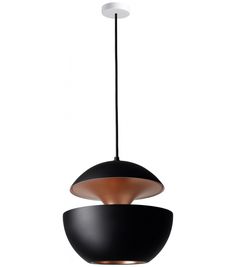 a black and copper pendant light hanging from a ceiling