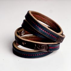 The Leather Wrap bracelets have been a top seller from the beginning. Choose from our everyday leather handbag leathers stitched to the top of our latigo wrap bracelets. Wear alone or layer them for the perfect arm party---these pieces are sure to be a favorite! Layer them all! -Bracelet wraps twice around wrist -3 adjustable sizes Leather Bracelets For Everyday Use, Minimalist Leather Bracelets With Leather Strap, Minimalist Leather Bracelets For Everyday Use, Everyday Minimalist Leather Bracelets, Everyday Black Leather Bracelet, Leather Bracelet With Black Band, Leather Bracelet With Black Band As Fashion Accessory, Black Band Leather Bracelet, Leather Bracelet With Wrist Strap For Everyday Use