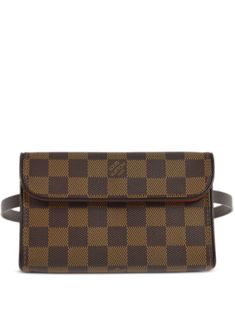 circa 2007 brown signature Damier Ebène canvas adjustable waist strap foldover top with magnetic fastening main compartment Condition: GOOD. This previously owned and used item is in good condition with minimal signs of use. This may include fading of material or plating and scratches. Purchasing this item continues its narrative and reduces the environmental impact by avoiding the use of new resources needed to make the product from scratch, such as water, materials and electricity, and avoiding additional manufacturing impact. Learn more about what makes a product Conscious on our Conscious Criteria page Luxury Coated Canvas Belt Bag For Everyday, Luxury Belt Bag With Removable Pouch In Coated Canvas, Designer Travel Belt Bag With Detachable Strap, Elegant Monogram Canvas Belt Bag, Designer Belt Bag With Detachable Strap For Travel, Monogram Canvas Belt Bag With Detachable Strap, Everyday Monogram Canvas Crossbody Belt Bag, Designer Pouch Belt Bag With Detachable Strap, Designer Monogram Canvas Crossbody Belt Bag