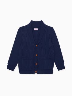 La Coqueta's Axel Merino Boy Cardigan is made up of pure Merino wool for the most luxuriously soft handle, knitted in Spain by artisans. It has a classic shawl collar silhouette, with knotted leather buttons to fasten, long sleeves, comfortable dropped shoulders and two front waist patch pockets. Rendered in a classic shade of navy blue that is simultaneously school-friendly and sufficiently elevated for weekend wear, it has a statement contrast-knit construction with racking and seed stitches t Boys Cardigans, Seed Stitch, Tailored Jacket, Clothes Crafts, Weekend Wear, Knit Outfit, Smock Dress, Shawl Collar, Jumpers And Cardigans