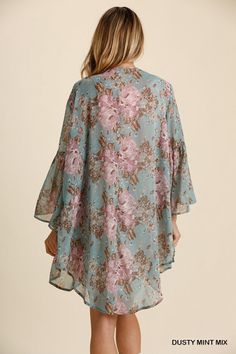 Treat yourself to soft floral comfort with this billowing hi-lo kimono cardigan. The open front and flowing bell sleeves create an effortlessly breezy style, ideal for lazy Sunday morning coffees or cozy movie nights in. The curved hemline and pretty floral print add a touch of feminine charm without saccharine sweetness, instantly elevating the most mundane of everyday outfits. 100% Polyester Want to view this on the *Live* Sizing & Styling Guide?! Watch it in the photo section above! *You will Bohemian V-neck Cardigan For Loungewear, Flowy V-neck Cardigan For The Beach, V-neck Floral Print Kimono For Fall, Flowy V-neck Kimono For Day Out, Summer Feminine Floral Print Kimono, Feminine Floral Print Summer Kimono, Flowy Floral Print V-neck Kimono, Bohemian V-neck Cardigan With Floral Print, Summer Bell Sleeve Kimono