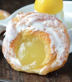 a lemon filled pastry on a wooden table