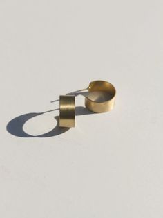 Golden Mini Hoops - Mango + Main Minimalist Metal Round Huggie Earrings, Minimalist Round Metal Huggie Earrings, Minimalist Everyday Brass Huggie Earrings, Everyday Minimalist Brass Huggie Earrings, Cadmium-free Brass Small Hoop Jewelry, Minimalist Brass Huggie Earrings, Minimalist Yellow Gold Brass Huggie Earrings, Minimalist Small Hoop Brass Jewelry, Minimalist Metal Small Hoop Huggie Earrings