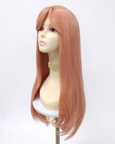 "Long straight wig featuring a fixed center skin part and bangs. Inside cap has 2 combs and adjustable elastic straps for a secure fit. Heat resistant up to 350F. Color: Peach Style: 24.5\" inches, Long and Straight with Bangs Circumference: Default at 21\" with adjustable cap (max 22\") Materials: Heat Resistant Synthetic Wig Fibers All sales are final. Please read all store policies before purchasing." Straight With Bangs, Human Hair Pieces, Long Straight Wig, Pink Wig, Wig With Bangs, Straight Wig, Synthetic Wig, Wigs With Bangs, Remy Hair