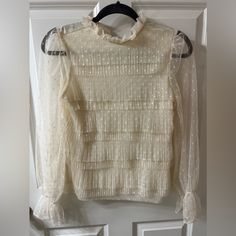 Express Cream Blouse With A Ruffle Trim Neck And Sleeve. Button In Back. Sheer Dot Pattern On Sleeves. Cream Tops For Fall Party, Cream Blouse For Fall Party, Cream Party Top For Fall, Fall Party Cream Tops, Cream Long Sleeve Sheer Top, Long Sleeve Sheer Cream Top, Cream Long Sleeve Top For Night Out, Basic Long Sleeve Shirt, Beige Boho