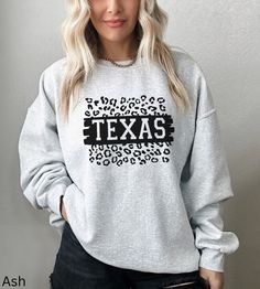 Texas Sweatshirt, Texas Crewneck, Austin Texas, Preppy Sweatshirt, State Trendy Sweatshirt, Aesthetic Sweatshirt, Cheetah Texas Sweatshirt Our shirts are made to order specially for you. Because of this reason we don't accept returns or exchanges. Please check our color and size charts before you place your order. If you have any questions please send us a message to clarify sizing or colors. Ideal for any situation, a unisex heavy blend crewneck sweatshirt is pure comfort. These garments are made from polyester and cotton. This combination helps designs come out looking fresh and beautiful. The collar is ribbed knit, so it retains its shape even after washing. There are no itchy side seams on these sweaters. ✨ Gildan Brand ✨ 50% cotton, 50% polyester ✨ Medium-heavy fabric 8.0 oz ✨ Loose f Casual Leopard Print Sweater, Fall Leopard Print Tops With Letter Design, Fall Leopard Print Top With Letter Details, Texas Sweatshirt, Preppy Sweatshirts, Texas Shirt, Aesthetic Sweatshirt, Sweatshirt Aesthetic, Texas Shirts