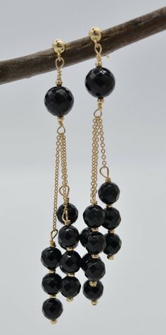 New 14K Solid Yellow Gold Faceted Black Onyx Chandelier Earrings are a stylish, Fashionable, and important piece for everyday wearing. This real 14k Gold earring is an uncomplicated matching gift to represent your love and a cloying surprise as a special gift to your mom, daughter, grandma, sister, niece, friends, and girlfriend. Specifications: 14K Solid Yellow Gold (Not Plated) These earrings sway with playful movement and shine. Triple chains of 14K gold and faceted black onyx beads. High-Pol Elegant Black Beaded Chandelier Earrings, Elegant Black Chandelier Earrings With Dangling Beads, Black Round Earrings With Dangling Beads, Black Elegant Chandelier Earrings For Formal Events, Black Onyx Earrings For Parties, Onyx Chandelier, Gold Schmuck, Gold Jewelry Earrings, Onyx Bead