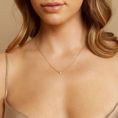 Our Diamond Solitaire Bezel Necklace features a round brilliant-cut diamond effortlessly balanced within a minimal gold bezel. Anchored by a delicate but sturdy 14K cable chain, this is a staple necklace for any stack. Wear this solid 14K necklace everyday! Small - 0.04ct Medium - 0.07ct Large - 0.12ct High  Quality G- Staple Necklace, Simple Choker, Minimal Gold, Necklace Everyday, Bezel Necklace, Solitaire Necklace, Diamond Solitaire Necklace, Ruby Necklace, Solitaire Necklaces