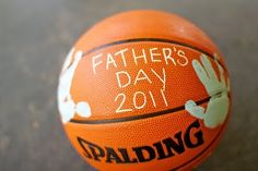 an orange basketball with the words father's day 2011 written on it