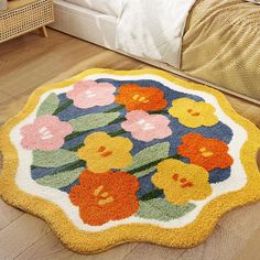 a rug with flowers on it in a bedroom