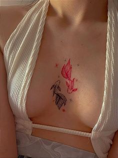 a woman's chest with a butterfly tattoo on it