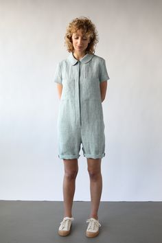 Linen playsuit made from a soft, medium weight, washed linen. Peter pan collar, hidden button closure, short sleeves.  - Handmade in our studio from from 100% linen - Relaxed fit with buttons opening at the front side - Peter pan color - Short sleeves - Front square pockets  - Seam side pockets Fitted Linen Jumpsuits And Rompers With Pockets, Relaxed Fit Linen Short-sleeved Jumpsuit, Relaxed Fit Linen Jumpsuit With Short Sleeves, Relaxed Fit Linen Jumpsuits And Rompers With Short Sleeves, Summer Linen Jumpsuits And Rompers With Button Closure, Casual Linen Jumpsuits And Rompers With Buttons, Summer Playsuit, Short Sleeve Jumpsuits, Linen Jumpsuit