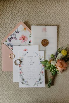 the wedding stationery is laid out and ready to be put into the bride's bouquet