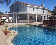 a house with a swimming pool in the front yard