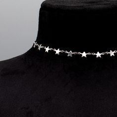 A Classic Gothic minimalist stainless steel choker 10mm Width Stainless Steel Star Link Chain 4 Inch 4.7mm Stainless Steel Adjuster Chain Hand Made in the UK Sizing: Small 11 - 15 Inches (28cm - 38cm) Medium 13 - 17 Inches (33cm - 43cm) Large 15 - 19 Inches (38cm - 48.5cm) Silver Stainless Steel Choker With Clavicle Chain, Adjustable Silver Stainless Steel Choker, Adjustable Stainless Steel Silver Choker, Star-shaped Metal Choker As Gift, Star-shaped Metal Choker For Gift, Adjustable Silver Star Choker, Gothic Minimalist, Star Choker, O Ring Choker