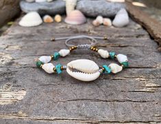 Mother nature creates best jewelry pieces! An authentic selection of natural shells handpicked from Greek beaches around the islands of the  Aegean sea! Hand-crafted into one of a kind, summer bohemian bracelet!  ▽▲Details▽▲ ★15-16m aprox. natural Cowrie shell ★9mm aprox natural white cone snail shells  ★5-7mm natural turquoise chips ★4mm round African Turquoise beads  ★mineral graphite beads ★clever fastening to secure perfect fit  ★Fine quality silk thread ★Adjustable Length ★Nickel free/Allerge free materials  ★Waterproof  ★Made in Greece! These unique shells are handpickjed from the beaches of the islands around the South Aegean sea. They are 100% natural & one of a kind pieces.  Perfect gift idea for birthdays, celebrations & anniversaries!  'Πάθος' is the Greek word for 'Passion' Lux Shell Bracelet Jewelry For Vacation, Shell Jewelry Bracelet For Vacation, Bohemian Cowrie Shell Strand Bracelet, Beachy Cowrie Shell Strand Bracelets, Bohemian Cowrie Shell Bracelets For Beach, Cowrie Shell Beaded Bracelets For The Beach, Shell Strand Bracelets For Beach Season, Cowrie Shell Beaded Bracelets For Vacation, Vacation Cowrie Shell Strand Bracelets