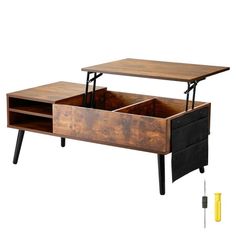 a wooden table with two drawers on it and some tools in the bottom drawer next to it