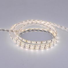 three white led strip lights on a gray background