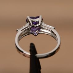 It is real natural amethyst ring, the heart amethyst gemstone is about 8mm*8mm.The basic metal is sterling silver and plated with rhodium.To change the metal to a solid gold (white/rose) or platinum is also available, please ask for a quotation if you want.You can also go to my shop Home for more elegant rings: https://www.etsy.com/shop/godjewelry?ref=hdr_shop_menuAmethyst is the birthstone of January. More amethyst rings:https://www.etsy.com/shop/godjewelry?ref=hdr_shop_menu&section_id=2070 Purple Engagement Rings, Engagement Ring Baguette, February Birthstone Ring, Elegant Rings, Baguette Engagement Ring, Ring Baguette, Silver Engagement Ring, Baguette Ring, Sterling Silver Engagement Rings