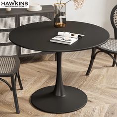 a black table with two chairs next to it