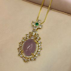 Only One In Stock. Gold Tone Metal. Pink Glass. Clear And Green Cz Stones. Necklace Has A Bolo Adjustment. Longest Length Is 18 Inches Pink Oval Cubic Zirconia Necklaces, Pink Oval Cubic Zirconia Necklace, Pink Oval Pendant Jewelry For Wedding, Pink Rhinestone Pendant Jewelry, Elegant Jeweled Pink Necklace, Elegant Pink Jeweled Necklace, Pink Rhinestone Pendant Necklace, Elegant Pink Necklace With Rhinestones, Elegant Pink Necklaces With Rhinestones