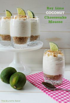 key lime coconut cheesecake mousse in small glasses on a cake stand with three limes