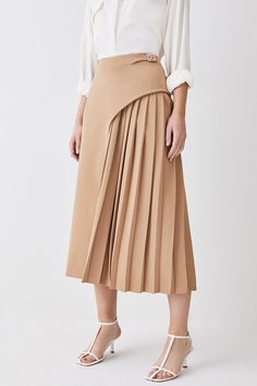 Feel Elegant In Our Midi Skirt, With A Universally Flattering Silhouette, Pleated Detailing, And A High Waistline, Perfect For Getting A Little Dressed Up. Style This Piece With Strappy Heels For An Outfit That Will Turn Heads From Office Days To Upcoming Occasions And Events. Tailored Buckle Detail Pleated Midi Skirt Formal, Flowing Fit High Waistline Unique Pleated Panel Midi Length Metallic Buckle At Waistline Pleat Skirt, Printed Pleated Skirt, Africa Fashion, Upcycled Denim, Asymmetrical Design, Pleated Midi Skirt, Karen Millen, Circle Skirt, Gq