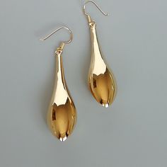 A PAIR of long teardrop bauble. This is a sterling silver earring dipped in gold. Size: Length: 5.3cm Width at widest section: 11 x 13 mm Weight: 7.25 gm Drop length: 6.4 cm These earrings are made of real 925 hypoallergenic sterling silver, dipped in real gold. Can be packaged in a gift box. I can write out a message from you to the receiver if needed. Please be free to contact me at... bhavnakwintra1956@gmail.com More hoops: https://www.etsy.com/your/shops/TheSilverGame/tools/listings/section: Gold Plated Teardrop Earrings For Party, Gold Drop Earrings Gift Set, Gold Drop Earrings As Gift With Matching Set, Gift Teardrop Earrings With Shiny Finish, Gold Single Drop Earring In Modern Style, Modern Gold Long Drop Earrings, Gold Teardrop Pendant Earrings For Gift, Shiny Finish Teardrop Earrings As A Gift, Teardrop Earrings With Shiny Finish As A Gift