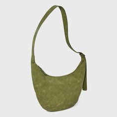 Bring a chic finishing touch to your everyday or dressy outfits with this Slouchy Crescent Sling Handbag from Universal Thread™. This unstructured handbag features a single zipper compartment to carry your phone, wallet, makeup essentials and other items. Plus, it has an interior zip pocket for any additional space you need. Designed in crescent shape and featuring a faux-suede finish in a solid hue, this handbag features an adjustable belt strap that make carrying it convenient and comfortable. Green Hobo Bag With Zipper Closure For On-the-go, Versatile Hobo Shoulder Bag With Cell Phone Pocket, Versatile Hobo Bag With Cell Phone Pocket, Versatile Handheld Hobo Bag For Travel, Functional Shoulder Bag For Errands, Chic Leather Hobo Bag With Cell Phone Pocket, Trendy Crossbody Hobo Bag With Zipper Pocket, Casual Hobo Bag With Cell Phone Pocket For On-the-go, Chic Everyday Hobo Bag With Cell Phone Pocket