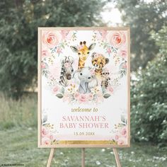 a welcome sign for a baby shower with animals on it and flowers around the frame