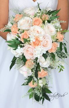 a bridal holding a bouquet of peach and white flowers