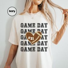 Elevate your Football game day apparel with this custom football mom shirt in Comfort colors.  Perfect for that football sports mom & fan.  Makes for a perfect Mothers day gift for her to show off at the field on Game day. PRODUCT Comfort Colors 1717 Tee made from 100% cotton, these shirts have a vintage feel and are often favored for their comfortable, worn-in look. How to order: *Please review all photos in listing *Select the item size and color, quantity *Provide personalization if offered { Collegiate T-shirt With Custom Print For Game Day, Team Spirit Tops With Number Print For Game Day, Team Spirit Top With Number Print For Game Day, Team Spirit Number Print Top For Game Day, Game Day Fan Apparel Top With Number Print, Game Day Graphic Tee With Team Name Sublimation Design, White Sublimation Design For Football Season Game Day, Game Day Graphic Tee With Sublimation Design, Collegiate Game Day T-shirt With Custom Print