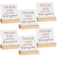 four thank you for being awesome cards on wooden stand with handwritten words in red ink