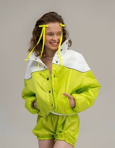 Jacket is made of raincoat fabric, has a lightweight insulation and a high collar, as well as a button closure and sleeves with hidden elastic. Among its special features is a reflective stripe along the yoke, which provides safety and visibility in the dark, as well as pockets that add convenience and functionality. The jacket is very lightweight and comfortable, making it ideal for use in the transitional seasons, when the temperature is not cold enough to wear heavy winter jackets. Available Long Sleeve Nylon Track Jacket For Winter, Winter Outdoor Track Jacket With Reflective Details, Functional Green Puffer Jacket With Long Sleeves, Winter White Outerwear With Reflective Details, White Reflective Winter Outerwear, Functional Green Long Sleeve Puffer Jacket, Sporty Green Long-sleeve Puffer Jacket, Sporty Green Long Sleeve Puffer Jacket, Green Sporty Puffer Outerwear