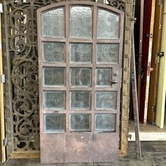 an old door with glass panes in front of it