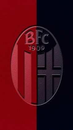 the back side of a red, black and blue wallpaper with an emblem on it