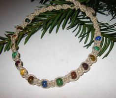 "This hemp choker necklace is created using a spiral and square knot weave embellished with tiny beads with \"stone-like\" colors of Picasso Czech glass. The necklace is finished with a bead and loop closure. Great for every day wearing:) Great Gift idea!💕 65" Hemp Choker, Hemp Jewelry, Hemp Necklace, Mini Macrame, Square Knot, Tiny Beads, Knot Necklace, Choker Necklaces, Glass Bead Necklace