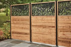 a wooden fence with metal screens on it