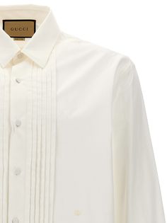 Cotton shirt with pleated plastron, button closure, long cuffed sleeves. Composition: 100% cotton Gucci Formal Button-up Blouse, Gucci Collared Blouse For Spring, Gucci Collared Blouse For Formal Occasions, Gucci Spring Collared Blouse, Gucci Formal Collared Blouse, Elegant Gucci Button-up Blouse, Gucci Button-up Blouse For Formal Occasions, Luxury Cotton Long Sleeve Dress Shirt, Luxury Long Sleeve Cotton Dress Shirt