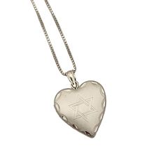 This elegant heart shaped locket is laser engraved with a classic Jewish Star of David on the front. It has beautiful engraved detailing on the border as well. The pendant has a matte/frosted finish and has space to hold two small heart shaped pictures inside. It comes on a sterling silver box chain, available in 16", 18" or 20" The perfect gift for mom or grandma! The locket measures approximately 1" long by 3/4" wide. Classic Engraved Heart Locket Necklace, Classic Heart-shaped Engraved Locket Necklace, Classic Engraved Heart Shaped Locket Necklace, Engraved Open Heart Locket Necklace, Engraved Double Heart Locket Necklace In White Gold, Classic Engraved Open Heart Necklace, Heart Shaped Pictures, David Ring, Heart Shaped Locket