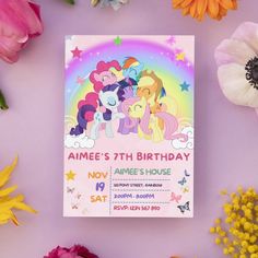 an image of a birthday card with ponys on the front and rainbow in the back