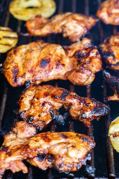 grilled chicken and onion rings are being cooked on the grill