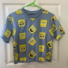 Never Worn Spongebob T Shirt In A Size Small. No Issues! Spongebob Crop Top, Trendy Blue Cartoon Print Shirt, Blue Fun Top With Funny Print, Fun Blue Crew Neck Top, Blue Tops With Funny Print, Blue Crew Neck Fun Tops, Blue Crew Neck Top With Fun Style, Spongebob T Shirt, Mr Krabs