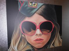 a painting of a woman wearing red sunglasses