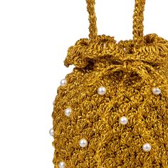 DESCRIPTION A Suryo classic. This crochet bucket has a cluster of handwoven acrylic pearls throughout the body to give it that extra va va voom! This style has a drawstring with acrylic pearl and glass beads, to keep your goodies safe. Fully lined in signature Suryo Batik. COLOUR Gold (Very very gold!) COMPOSITION Body: 100% metallic yarn- Embellishments: acryllic pearls - Lining: 100% cotton SIZE & FIT Height Including handle 30cm Diameter 16cm SHIPPING Shipping fees are based on the total weig Luxury Handmade Bucket Bag, Luxury Gold Bucket Shaped Bag, Elegant Handwoven Bucket Bag, Elegant Gold Pouch Bucket Bag, Elegant Handwoven Gold Bag, Elegant Gold Handwoven Bag, Gold Pouch Bucket Bag As Gift, Gold Pouch Bucket Bag Gift, Gold Woven Crochet Bag As Gift