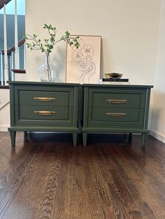 two green dressers sitting on top of a hard wood floor