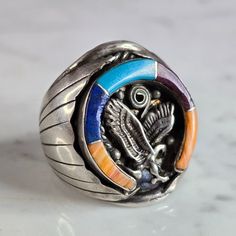 A Mens Vintage Estate Sterling Silver Southwestern Turquoise Eagle Ring. The Ring Is A Size 12.75 And Weighs 17.4g. Ring Measures 1 1/8" Long. Ring Does Have Two Dings In It, As Shown Int He Pics. Still A Great Piece Of Jewelry. Ring Is Marked "J, Sterling". Any Questions, Please Ask. Be Sure To Check Out Some Of My Other Great Items Up For Sale. Thank You Southwestern Polished Turquoise Ring Collectible, Eagle Ring, Long Ring, Mens Accessories Jewelry, Mens Vintage, Jewelry Ring, Silver Man, Rings Statement, Sterling Silber